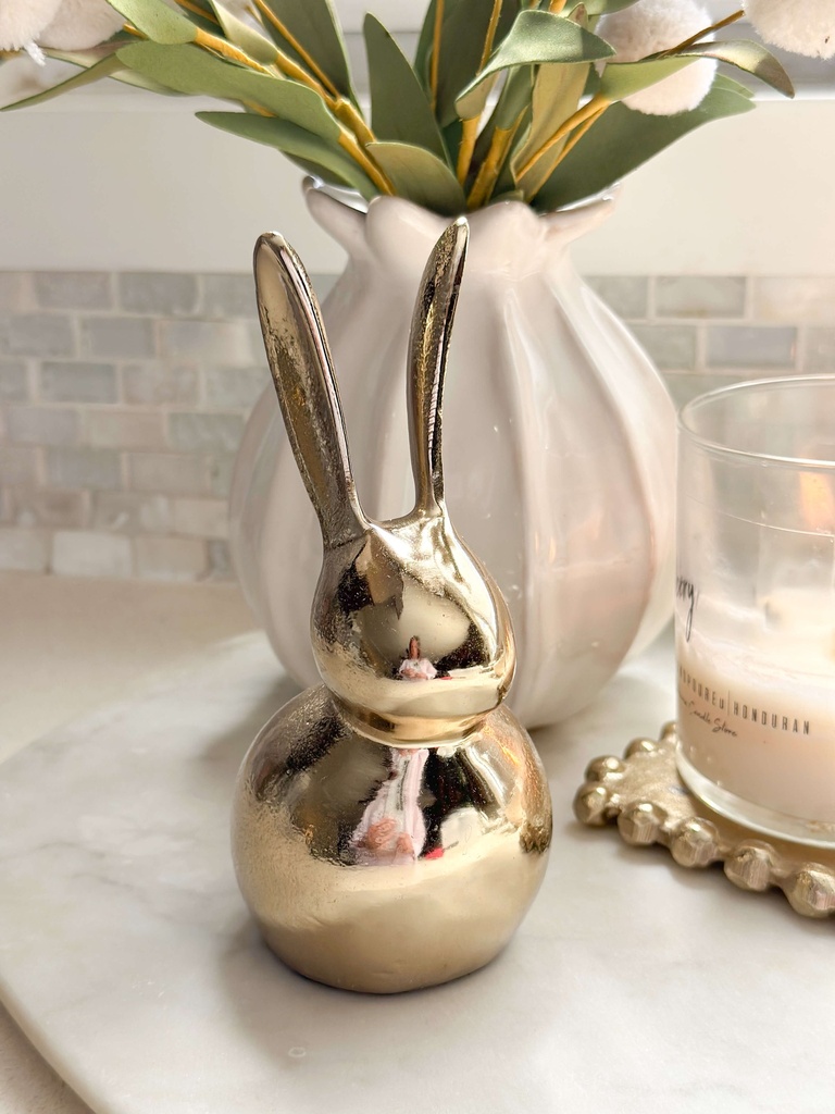 Conejito dorado de metal